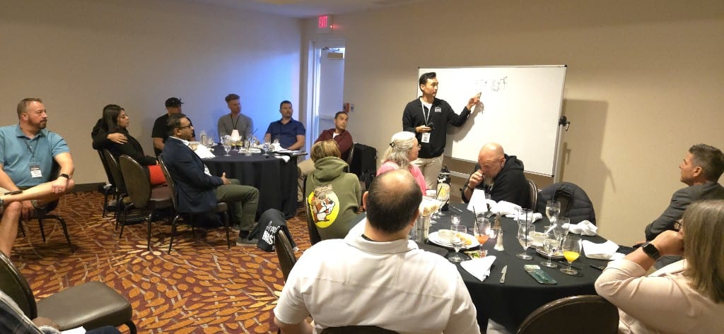 A live numbers walkthrough on the whiteboard during a seminar